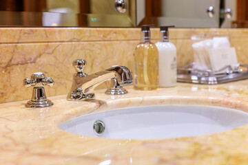 elegant sink and faucet in a beautiful charter yacht made from marble