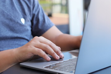 Cardholder male hands holding credit card online payment via e-bank. Male consumer pays for purchases in web stores using laptop technology. Online Shopping Concept. Dolly shot