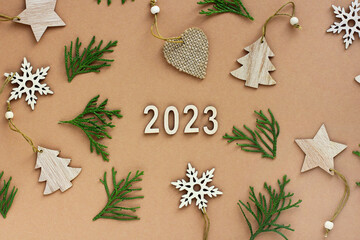 the new year is coming. wooden numbers 2023. Christmas decorations made of eco-friendly materials. toys made of wood, paper, cardboard