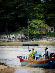 fisherman on the boat by the beach