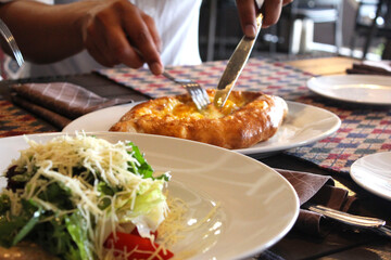 person holding a plate with food