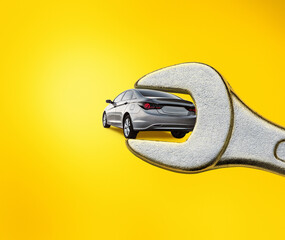 collage, gray car in wrench isolated on yellow background