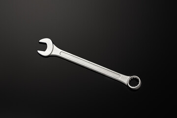 steel wrench isolated on black background