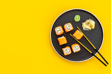 Japanese cuisine. Sushi roll set with salmon on dish