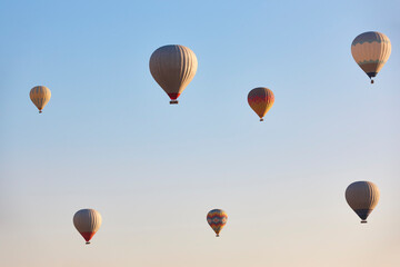 Spectacular balloons flying at sunrise in Goreme. Turism Cappadocia, Turkey