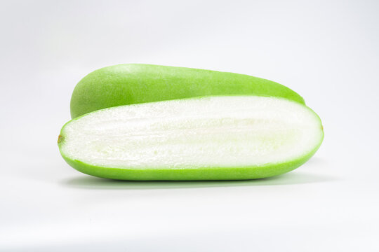 green fresh winter melon or white gourd with half isolated on white background