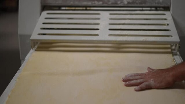 dough sheeter, artisan bakery, baker making bread and pastry, dough kneading