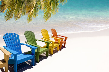 Colorful wooden chairs on white sand beach