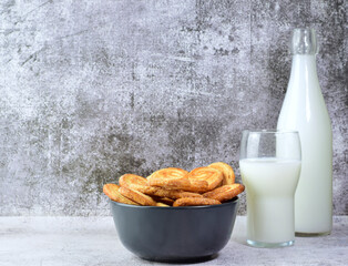 Palm leaf pastrie, accompanied with a glass of milk.	