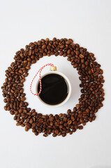 Christmas New Year coffee concept. Cup of black espresso coffee decorated as christmas tree ball. In round frame made of cofee beans. On white background