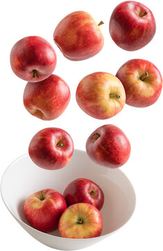 Red Apples Falling Into A Bowl