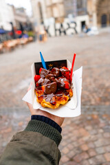 Belgian Waffles with Chocolate and Strawberries  at La gaufrerie near Grote markt in Antwerp during winter : Antwerp , Belgium : November 29 , 2019