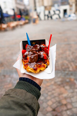 Belgian Waffles with Chocolate and Strawberries  at La gaufrerie near Grote markt in Antwerp during winter : Antwerp , Belgium : November 29 , 2019