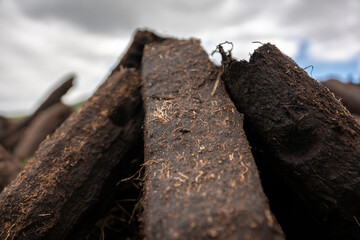 Hand cut turf is footed in Ireland. It has to dry in the sun and wind.