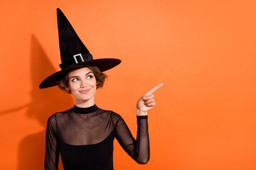 Photo portrait of adorable young lady look point halloween shop banner ad dressed trendy black...