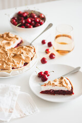 Plate with tasty cherry pie on white background. Top view. Front view