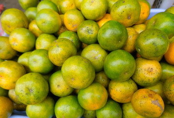 Orange fruit - large amounts of orange fruit, fresh orange fruit, orange fruit in a basket