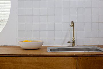White tiles wall with Blank sink. Modern kitchen still life.