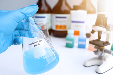 Buffer solution in glass, chemical in the laboratory and industry