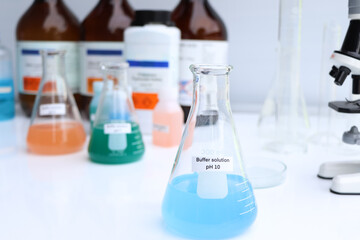 Buffer solution in glass, chemical in the laboratory and industry