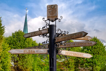 Direction sign to various places of interest in Maaseik, Belgium