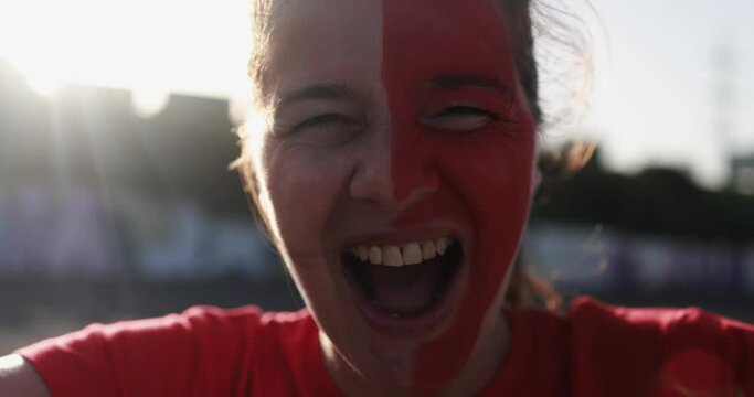 Red sport fan screaming out of the stadium before football match - Champions and winning concept
