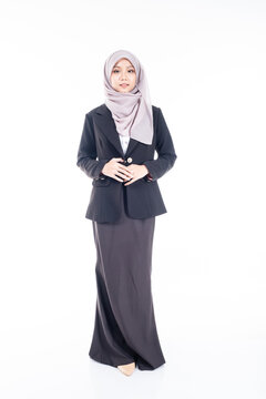 Portrait of Muslim woman in office attire and wearing a hijab. Asian woman in a corporate world. Formal corporate outfit and elegant appearance. Corporate or business people concept. Isolated