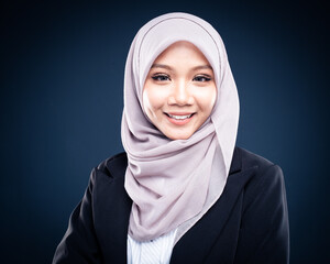 Portrait of Muslim woman in office attire and wearing a hijab. Asian woman in a corporate world. Formal corporate outfit and elegant appearance. Corporate or business people concept. Isolated