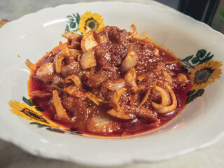 Fried anchovy sambal with onion slices is eaten with nasi lemak or white rice and is loved by many Malaysians