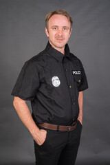 Portrait of Caucasian man wearing police uniform costume