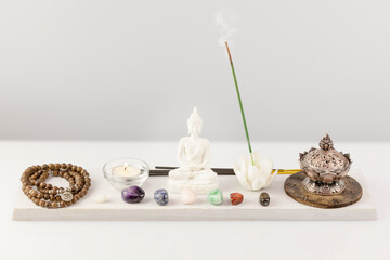 Self-care, healing composition with rosary beads, aroma bowl, aroma stick, buddha figurine, chakra...