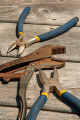 Close up of flat lay of wrenches on weathered deck floor