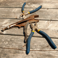 flat lay of wrenches on weathered deck floor