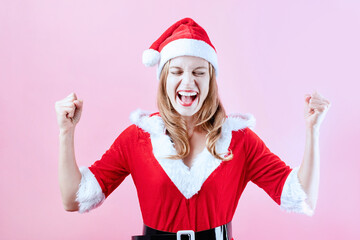 closeup of happy caucasian woman wearing santa clothes screaming emotionally