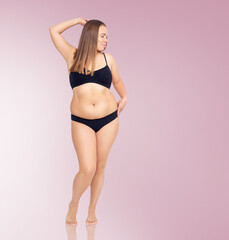 Confident woman with overweight natural body posing.