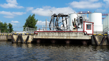 Port and platform with hoses for loading oil onto a ship, Kaliningrad, Russia