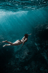 underwater girl who swim in deep ocean 01