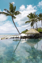 Luxury swimming pool in tropical infinity pool, relaxing holidays in Seychelles islands. La Digue