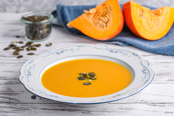 Traditional pumpkin soup with pumpkin slice