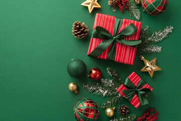 Christmas Day concept. Top view photo of present boxes with ribbon bows red green and gold baubles star ornaments pine cones mistletoe berries spruce branches in hoarfrost on isolated green background