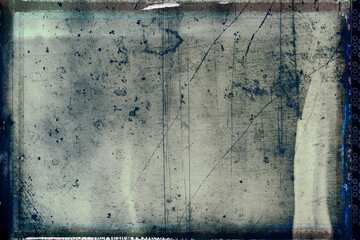 Vintage photo of a sand background with wet plate technique – film strip frame with grain, dust...