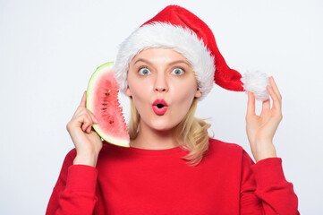 Travel vacation and holidays resort. Christmas girl eat watermelon. Woman santa hat hold slice watermelon. Exotic christmas celebration. Christmas summer destinations. Tropical christmas concept