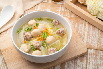 Chinese Cabbage Soup with Minced Pork and meatball in white bowl.Thai style clear soup