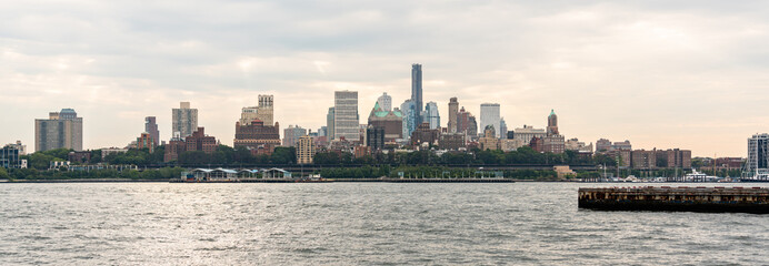 Panorama of Brooklyn skyscrapers across the East River on an overcast cloudy day