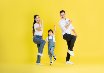 Fototapeta na wymiar happy asian family image, isolated on yellow background