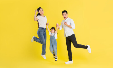 Fototapeta na wymiar happy asian family image, isolated on yellow background