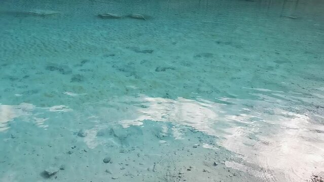 Crystal water of ’Blue Moon Valley' beneath Jade Dragon Snow Moutain and Yulong Glacier Yunnan China玉龙雪山蓝月谷