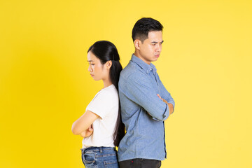 image of asian couple posing on yellow background - Powered by Adobe
