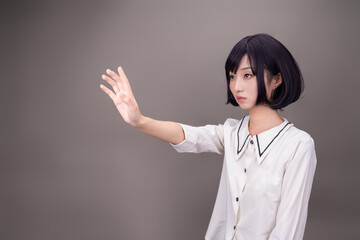 A girl in white on a gray background