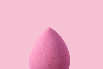 Closeup photography of beauty blender,pastel pink background.